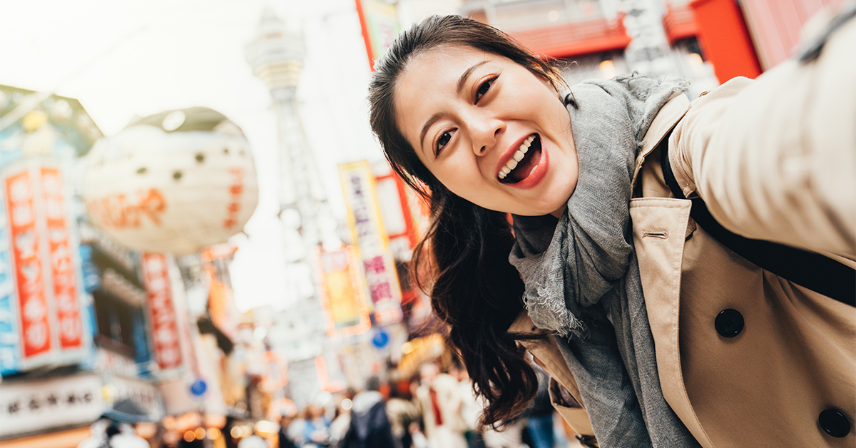 Woman taking a selfie in Japan